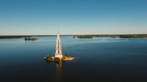 Ancient christian church located on an island in the middle of the lake. aerial view old monastery.