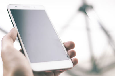 Close-up of hand using mobile phone