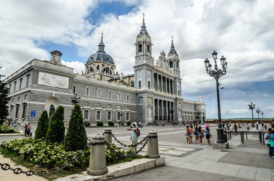 Facade of building against cloudy sky