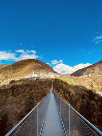 Scenic view of mountains against clear blue sky