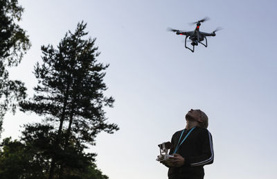 Boy flying drone