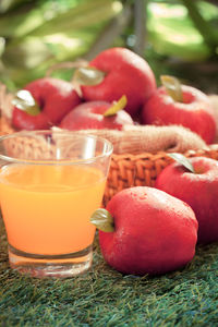 Close-up of red apple on table