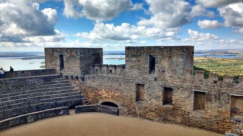 Old ruin building against cloudy sky