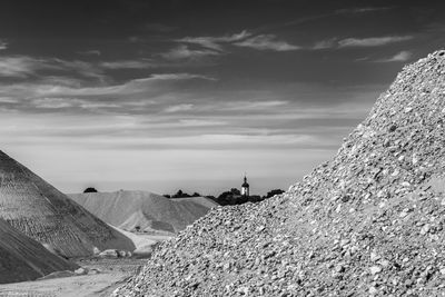 Heap of stones against sky