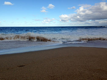 Scenic view of beach against sky