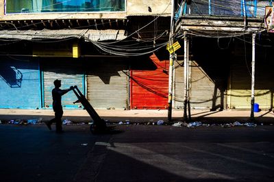 Full length of man with umbrella