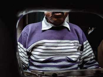 Portrait of man sitting in car