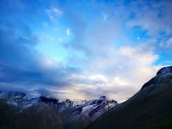 View of mountain range against cloudy sky