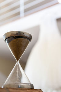 Close-up of clock on table