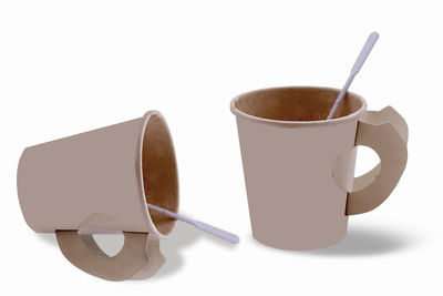 Close-up of coffee cup against white background