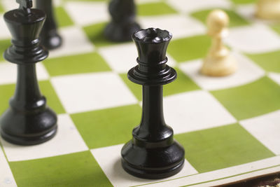 High angle view of chess pieces on floor