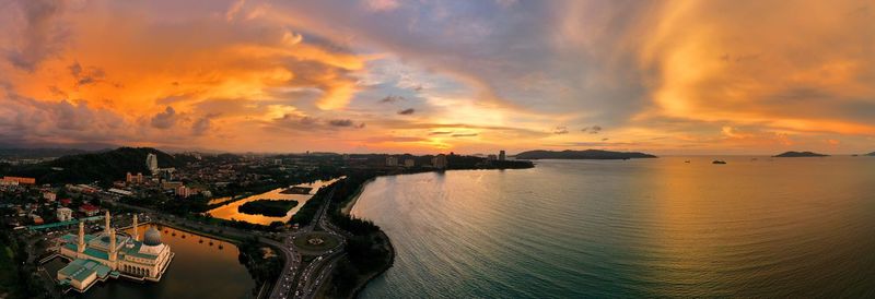 Panoramic view of sea against sky during sunset