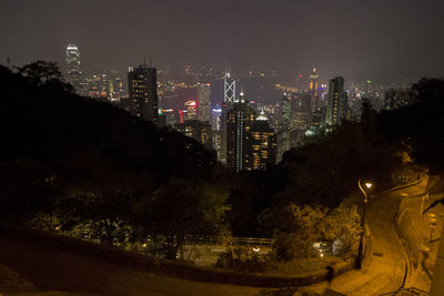 Illuminated cityscape during rainy season at night