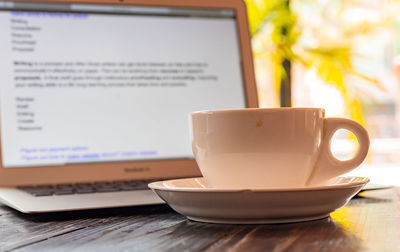 Close-up of coffee cup on table