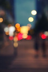 Defocused image of illuminated city at night