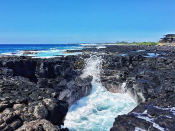 Scenic view of sea against clear blue sky