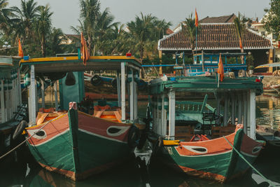 Boats moored on beach against sky