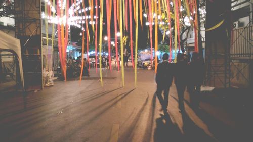 Blurred motion of woman in city at night