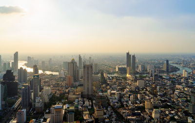 High angle view of modern buildings in city against sky