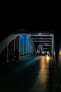 View of bridge in city at night