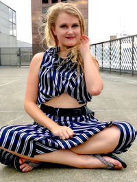 Portrait of teenage girl sitting outdoors