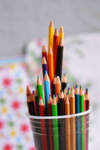 Close-up of multi colored pencils on table