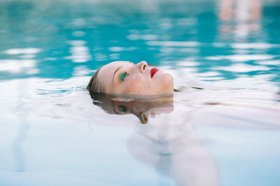 Teen girl having fun in the swimming pool