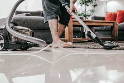 A man doing his house cleaning during lockdown