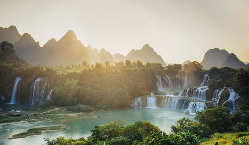 Panoramic view of river and trees against clear sky