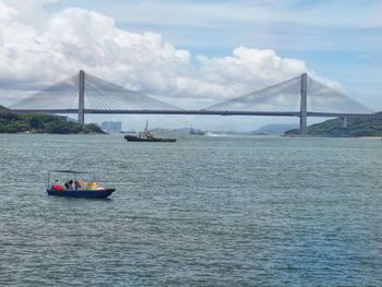 Scenic view of bridge over sea against sky