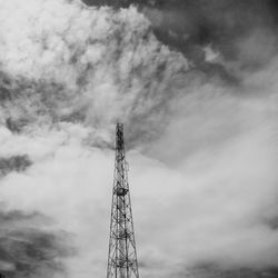 Low angle view of communications tower against sky