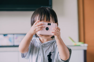 Portrait of boy photographing