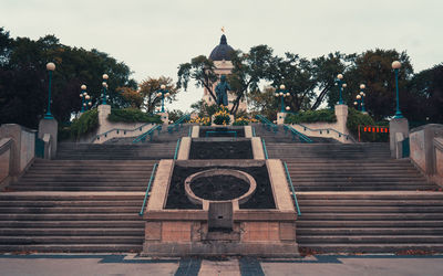 Staircase by building against sky