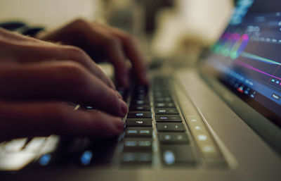 Close up of a hand of a human on a keyboard typing.