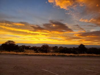 Scenic view of field against sky during sunset