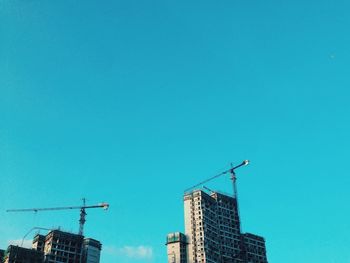 Low angle view of building against clear blue sky