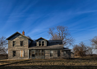 House on field against sky