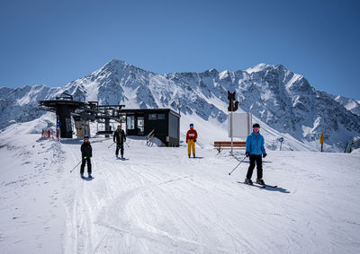 Family in the ski area in tirol near the chair lift