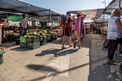 People at market stall