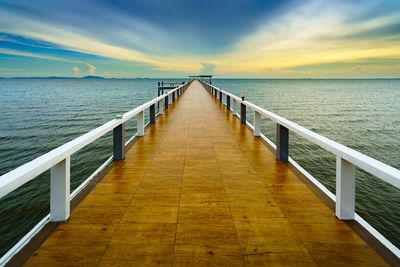 Pier over sea against sky
