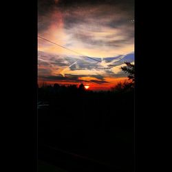 Silhouette of landscape against dramatic sky