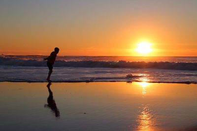 Scenic view of sea at sunset