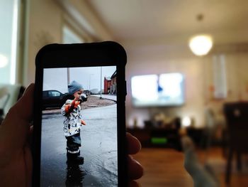 Man photographing with mobile phone