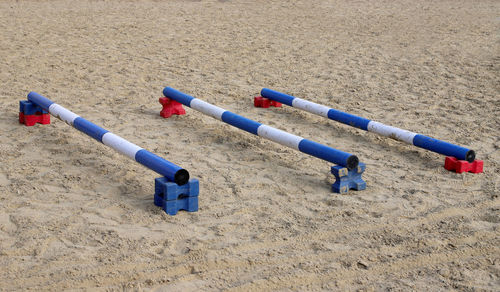 High angle view of deck chairs on beach