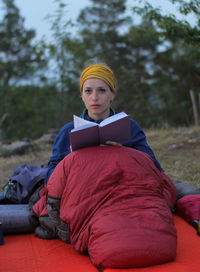 Portrait of mid adult man sitting on land