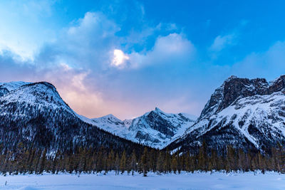 Winter wilderness sunset hiking in the snowy canadian rockies.