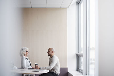 Business people talking during coffee break