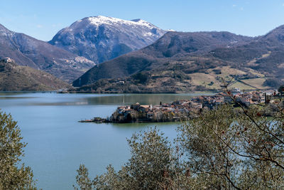 Scenic view of lake and mountains against sky