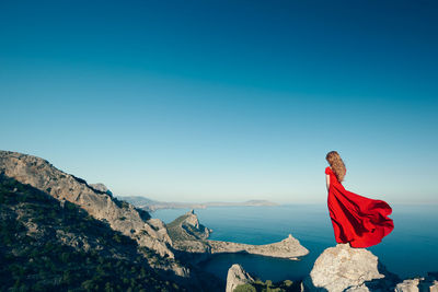 Scenic view of mountain against clear blue sky