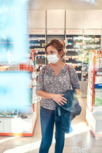Midsection of woman standing in store